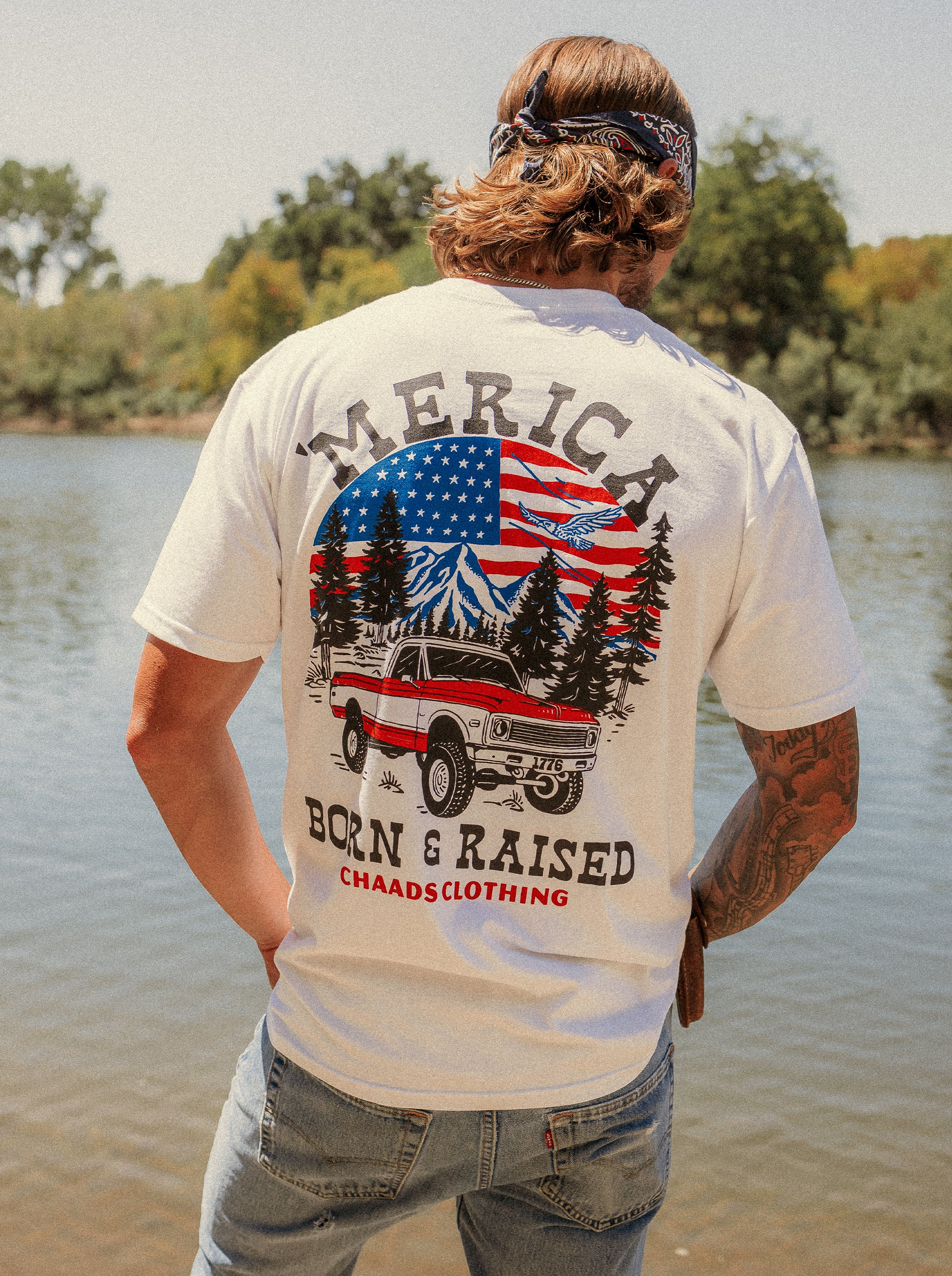 Born and Raised 'Merica T-shirt featuring a vintage truck and American flag design – Made in the USA